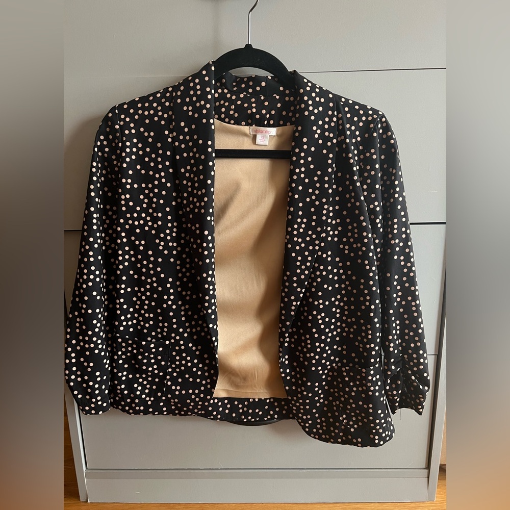Dark navy blazer with tan polka dots